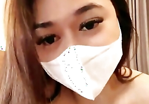 Contemporaneous Indonesia Viral doll enervating a mask is masturbating herself