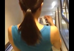 Asian bungle on the escalator